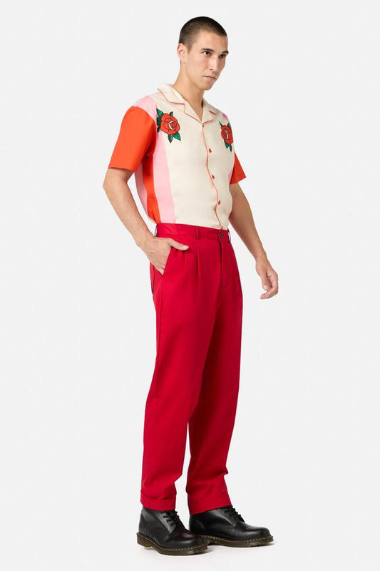 Image of a model wearing Pants. Productname: Love Letter Heart Unisex Pants in Red colour by brand - Dangerfield