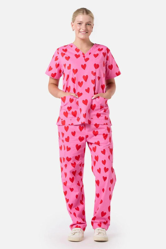 Image of a model wearing Uniforms & Workwear. Productname: Love Hearts Scrub Set in Pink colour by brand - Princess Highway