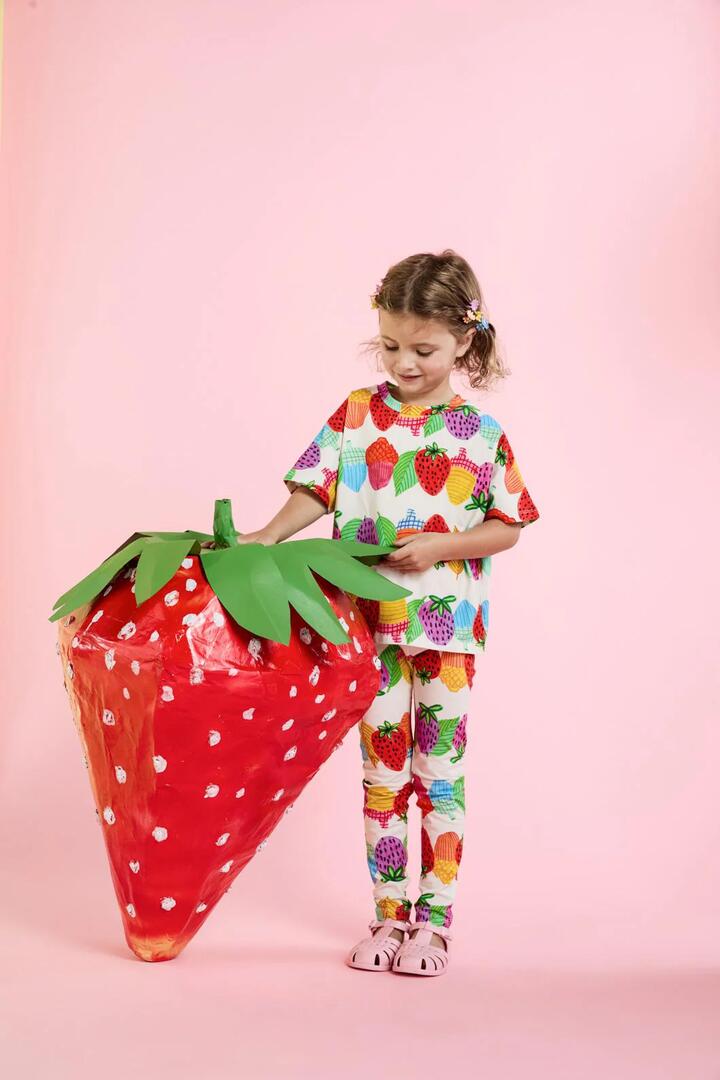 Image of a model wearing Tops. Productname: Acorn Stripe Kids Tee in Cream colour by brand - Princess Highway Kids