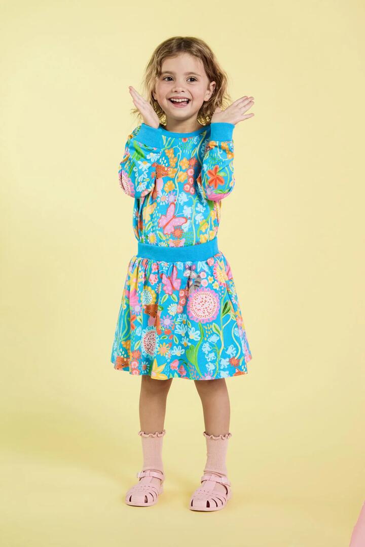 Image of a model wearing Skirts. Productname: Folk Flower Kids Skirt in Blue colour by brand - Princess Highway Kids
