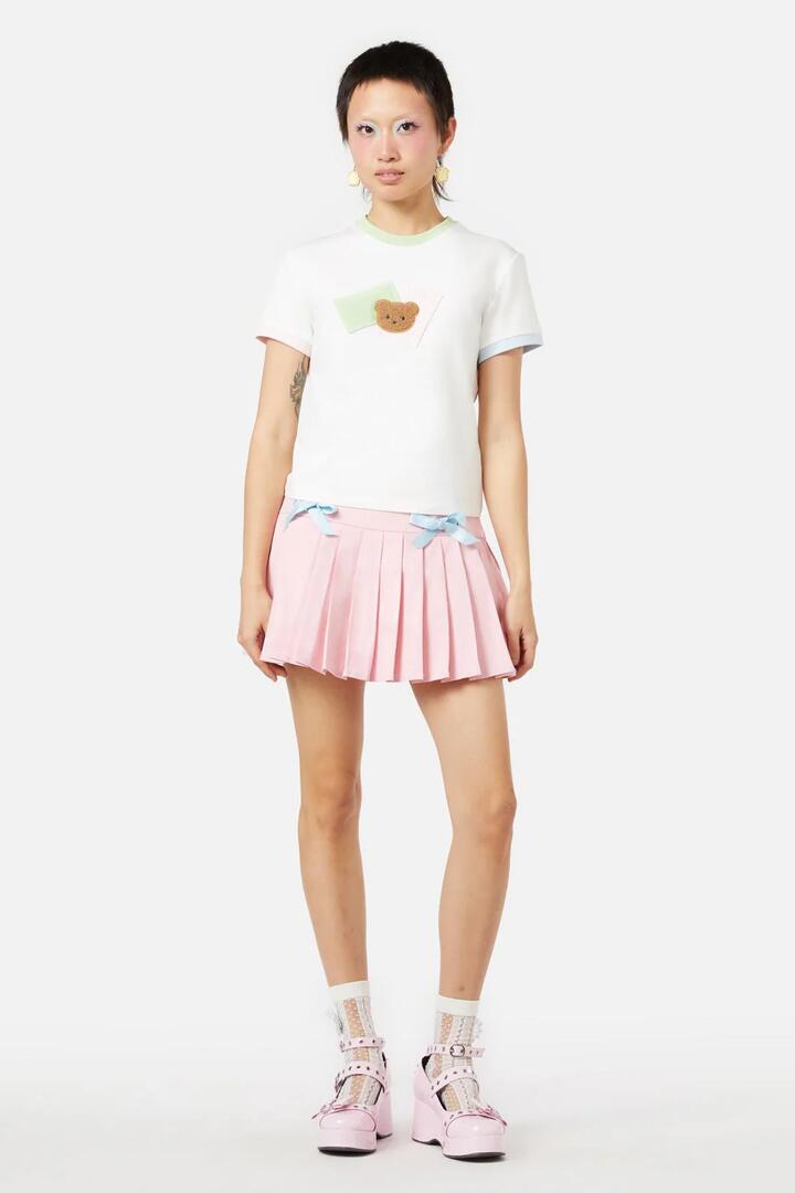 Image of a model wearing Tops. Productname: Vermont Patch Tee in White colour by brand - Dangerfield