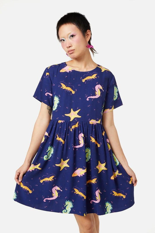 Image of a model wearing Dress. Productname: Riptide Dress in Navy colour by brand - Dangerfield