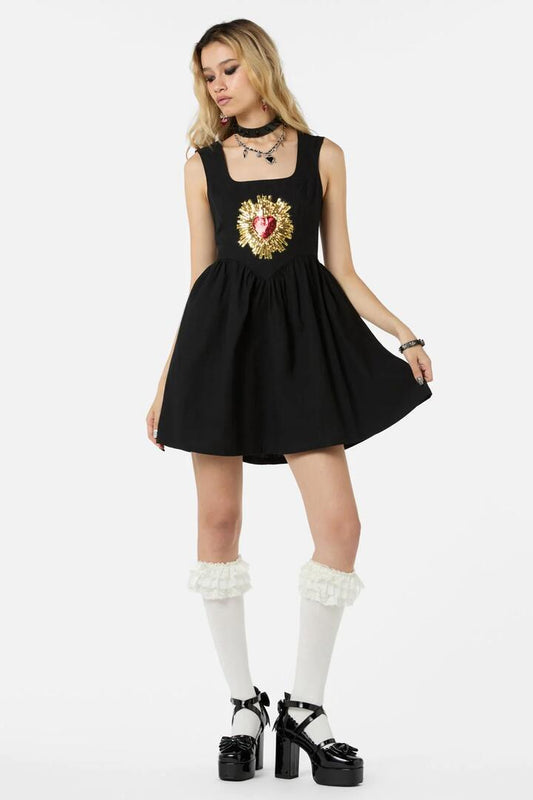 Image of a model wearing Dress. Productname: Divine Love Pinny in Black colour by brand - Dangerfield