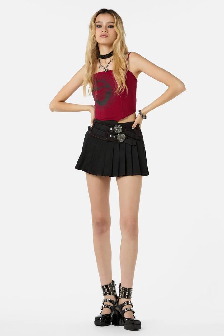Image of a model wearing Skirts. Productname: Immaculate Mini Skort in Black colour by brand - Dangerfield