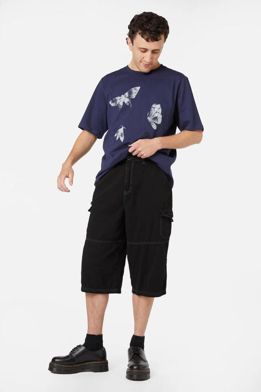 Image of a model wearing Shorts. Productname: Deep Dive Jorts in Black colour by brand - Dangerfield