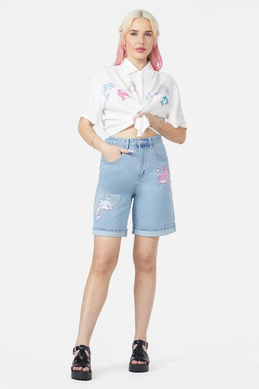 Image of a model wearing Shorts. Product name - Dolphin Embroidered Short in Blue colour by brand - Dangerfield