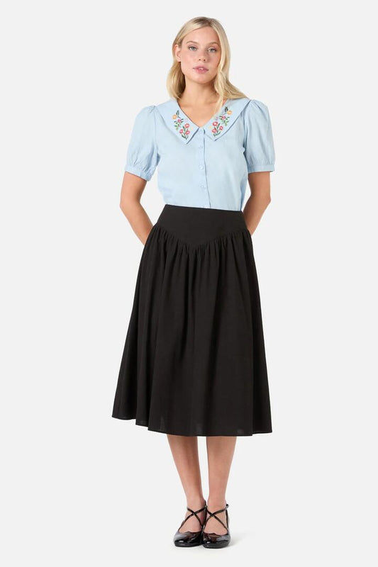 Image of a model wearing Skirts. Productname: Nell Gathered Yoke Skirt in Black colour by brand - Princess Highway