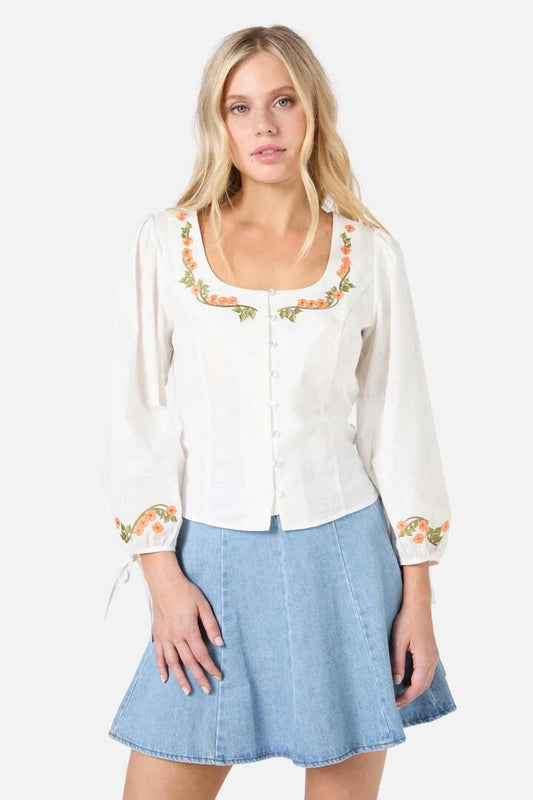 Image of a model wearing Tops. Productname: Flower Child Embroidered Top in Cream colour by brand - Princess Highway