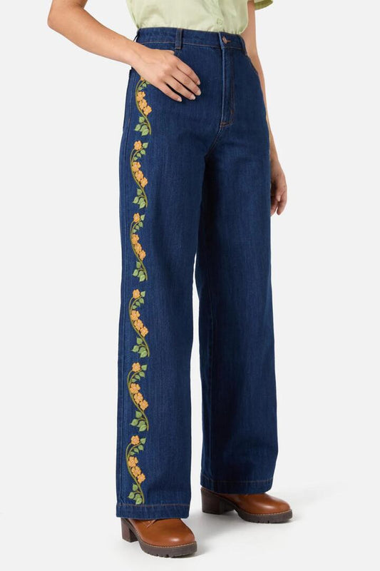 Image of a model wearing Denim. Productname: Flower Child Embroidered Jean in Blue Denim colour by brand - Princess Highway