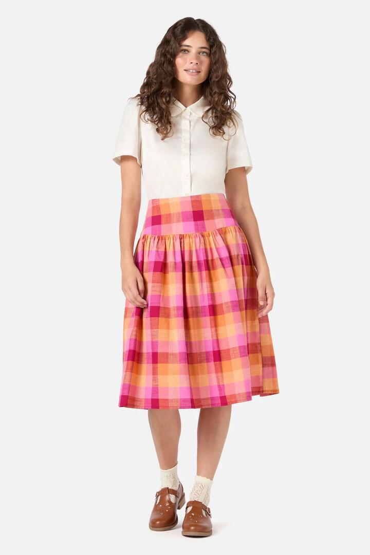 Image of a model wearing Skirts. Productname: Maxine Check Midi Skirt in Rose colour by brand - Princess Highway