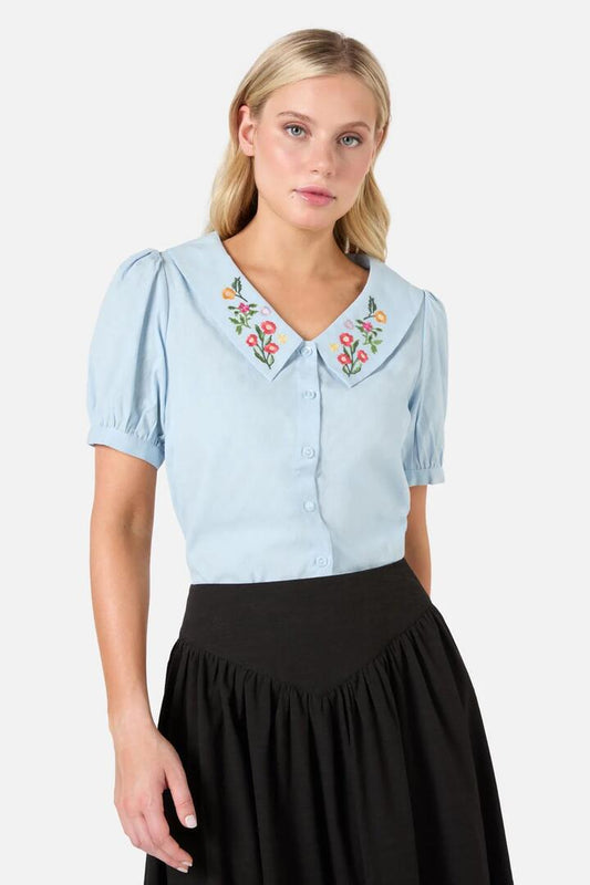 Image of a model wearing Tops. Productname: Lattice Embroiderd Blouse in Blue colour by brand - Princess Highway