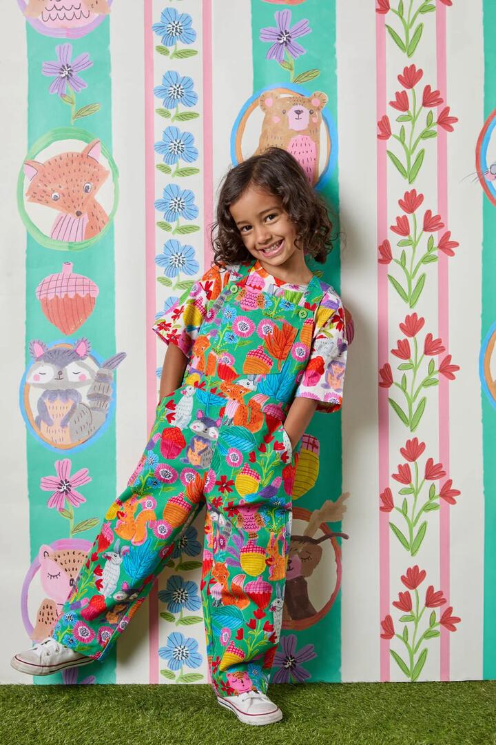 Image of a model wearing Pants. Product name - Woodland Kids Overalls in Green colour by brand - Princess Highway Kids