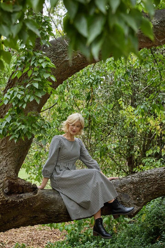 Image of a model wearing Dress. Productname: Renae Check Midi Dress in Black colour by brand - Princess Highway