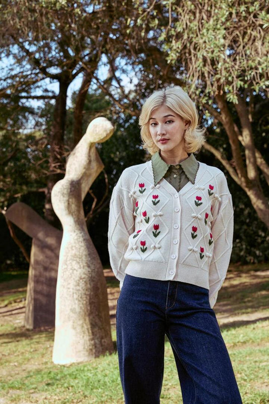 Image of a model wearing Outerwear. Productname: Tulip Embroidered Cardigan in Cream colour by brand - Princess Highway