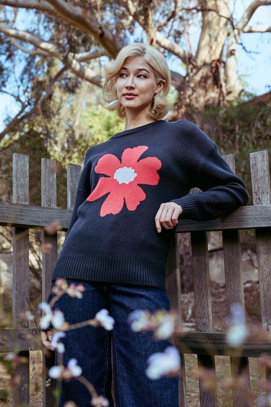 Image of a model wearing Outerwear. Productname: Big Flower Knit Jumper in Navy colour by brand - Princess Highway