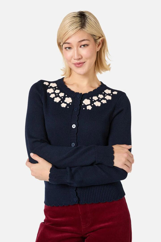 Image of a model wearing Outerwear. Productname: Meg Daisy Embroidered Cardigan in Navy colour by brand - Princess Highway