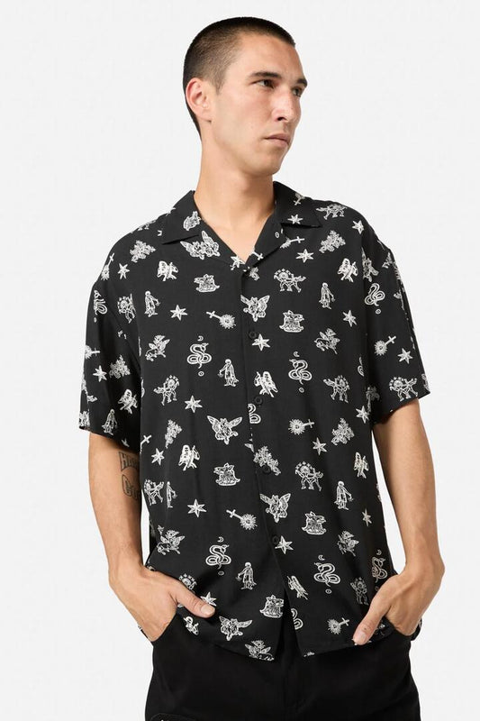 Image of a model wearing Tops. Productname: Darc Printed Relaxed Fit SS Shirt in Black colour by brand - Black Friday