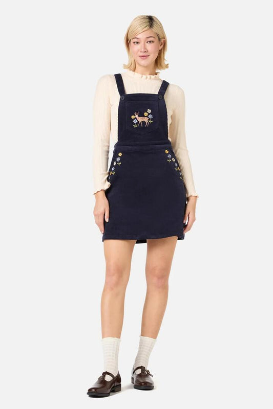Image of a model wearing Dress. Productname: Deer Embroidered Cord Pinny in Navy colour by brand - Princess Highway