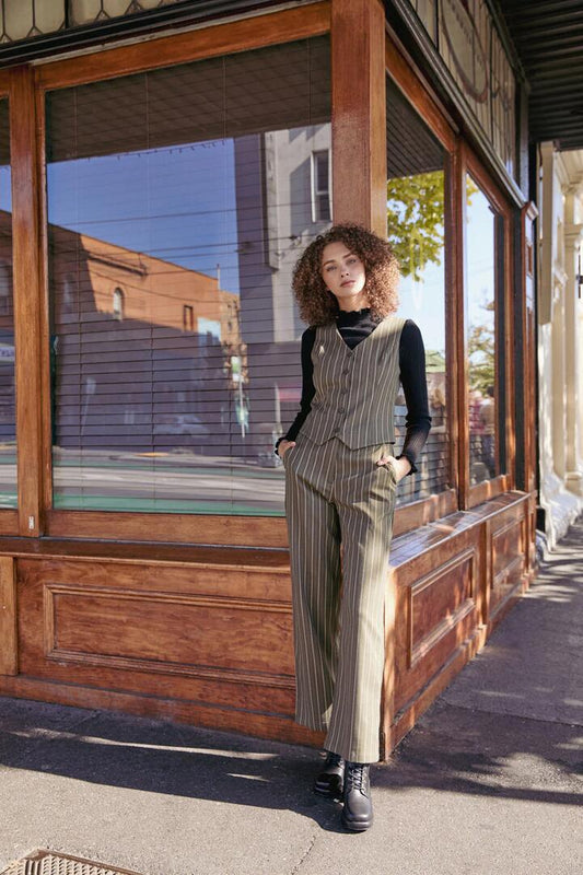Image of a model wearing Pants. Productname: Abby Pinstripe Pant in Olive colour by brand - Princess Highway