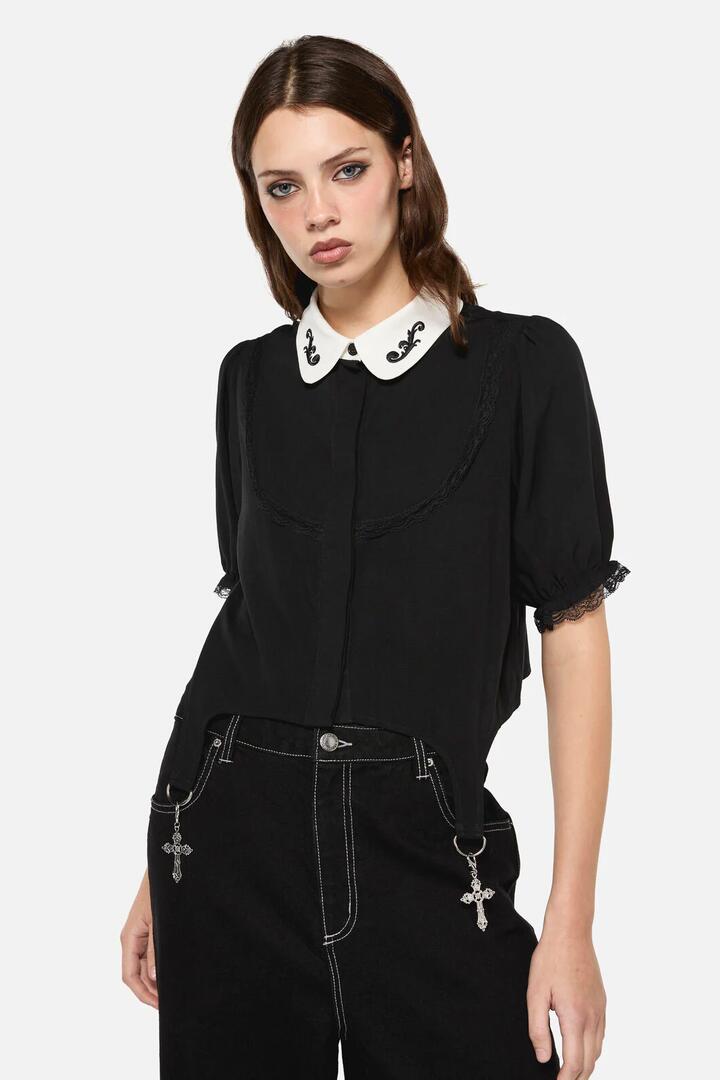 Image of a model wearing Tops. Productname: Little Bitter Maid Crop Blouse in Black colour by brand - Dangerfield