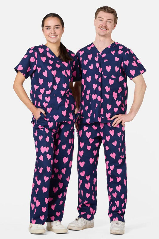 Image of a model wearing Uniforms & Workwear. Productname: Love Hearts Scrub Set in Navy colour by brand - Scrubs With Love