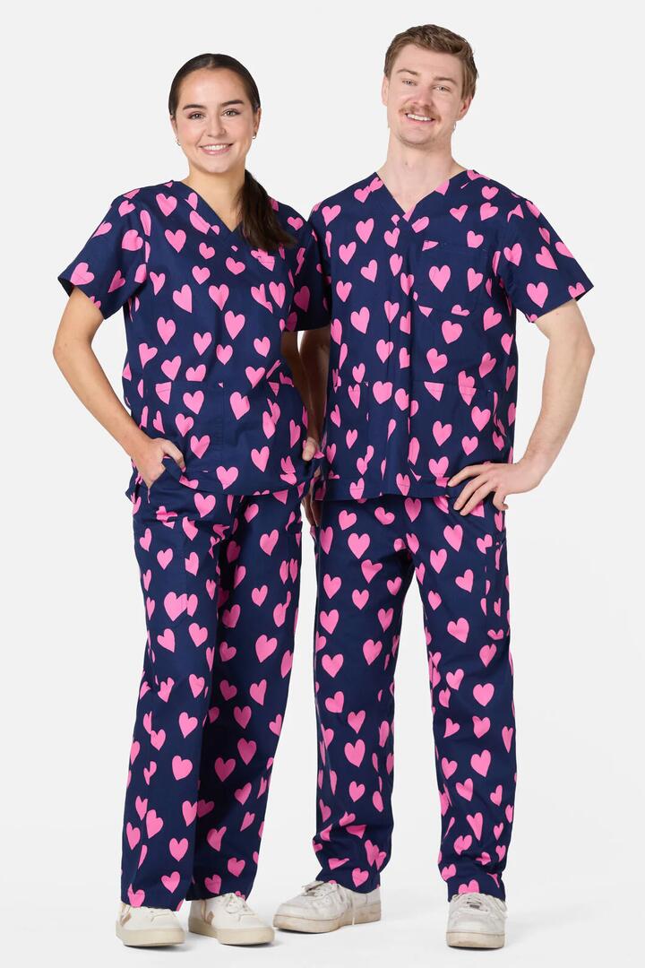 Image of a model wearing Uniforms & Workwear. Productname: Love Hearts Navy Scrub Set in Navy colour by brand - Scrubs With Love