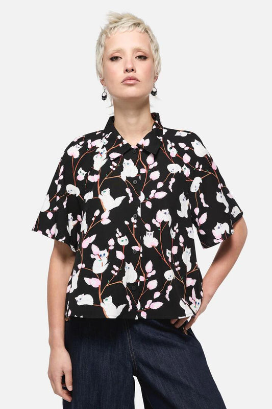 Image of a model wearing Tops. Productname: Pussy Willow Printed Blouse in Black colour by brand - Dangerfield