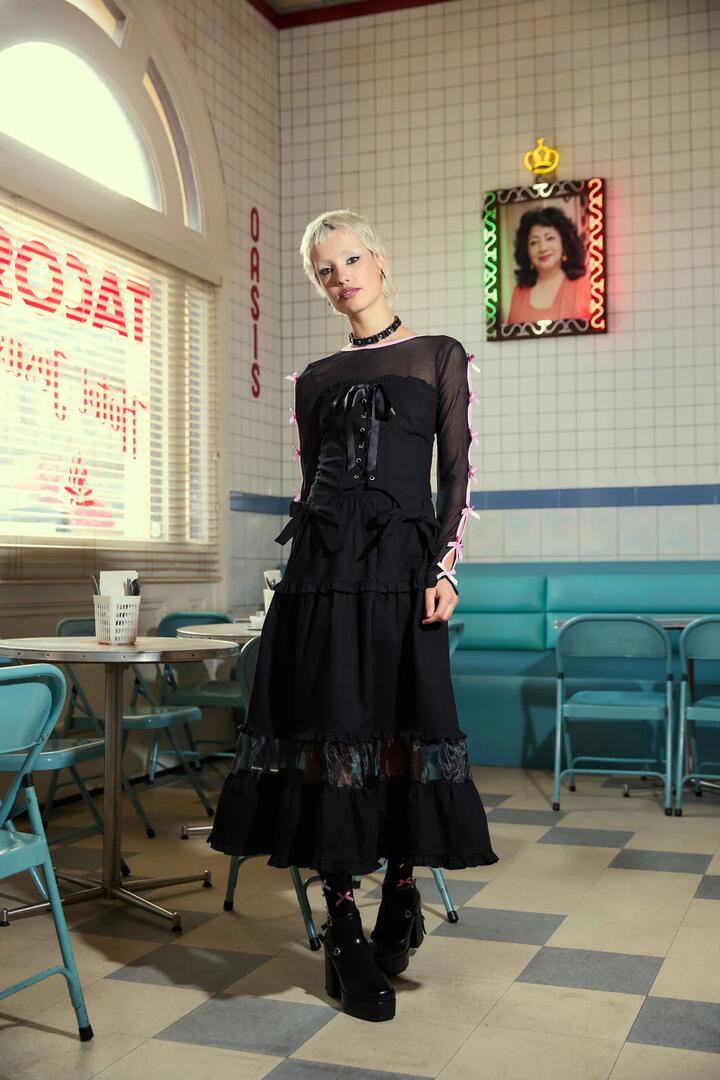 Image of a model wearing Skirts. Productname: Blooming Midi Skirt in Black colour by brand - Dangerfield
