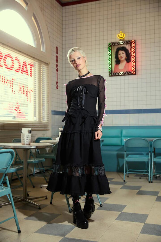 Image of a model wearing Skirts. Productname: Blooming Midi Skirt in Black colour by brand - Dangerfield