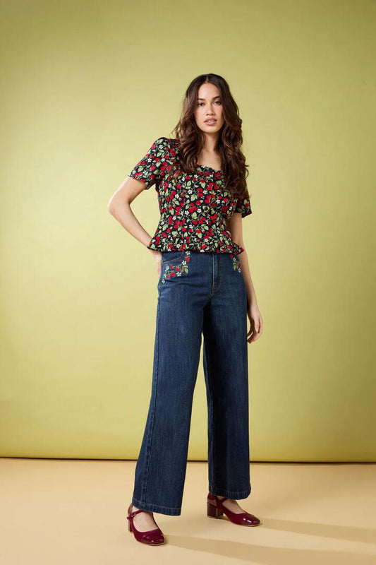 Image of a model wearing Denim. Productname: Raspberry Embroidered Jean in Blue Denim colour by brand - Princess Highway