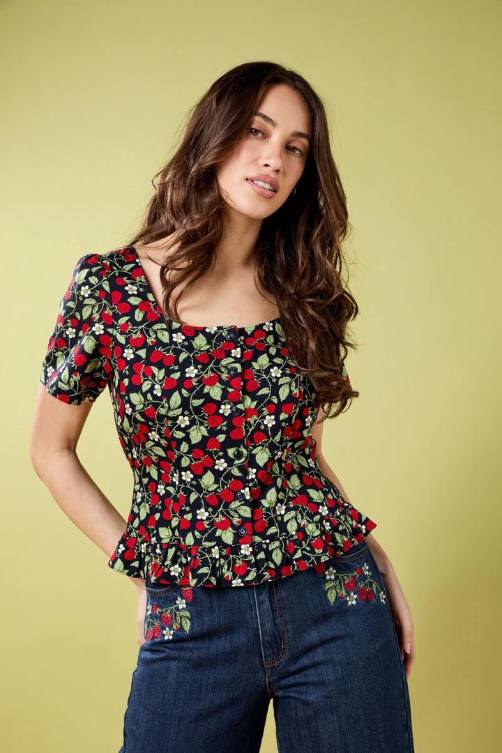 Image of a model wearing Shorts. Productname: Raspberry Short Sleeve Top in Navy colour by brand - Princess Highway