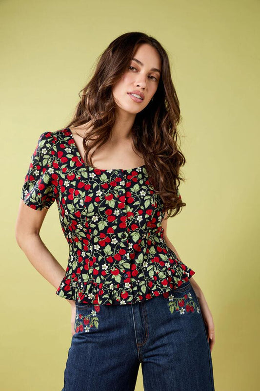 Image of a model wearing Shorts. Productname: Raspberry Short Sleeve Top in Navy colour by brand - Princess Highway