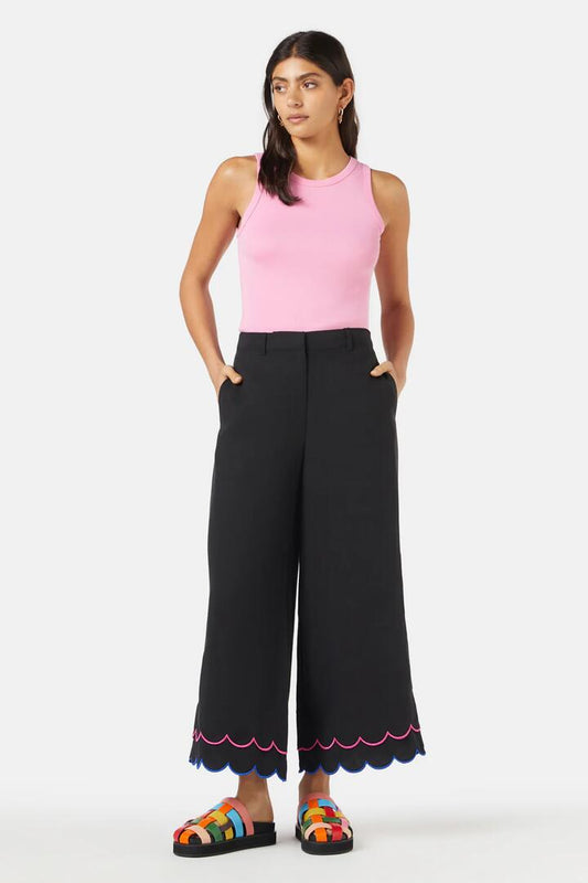 Image of a model wearing Pants. Product name - Neon Scallop Embroidered Pant in Black colour by brand - Gorman