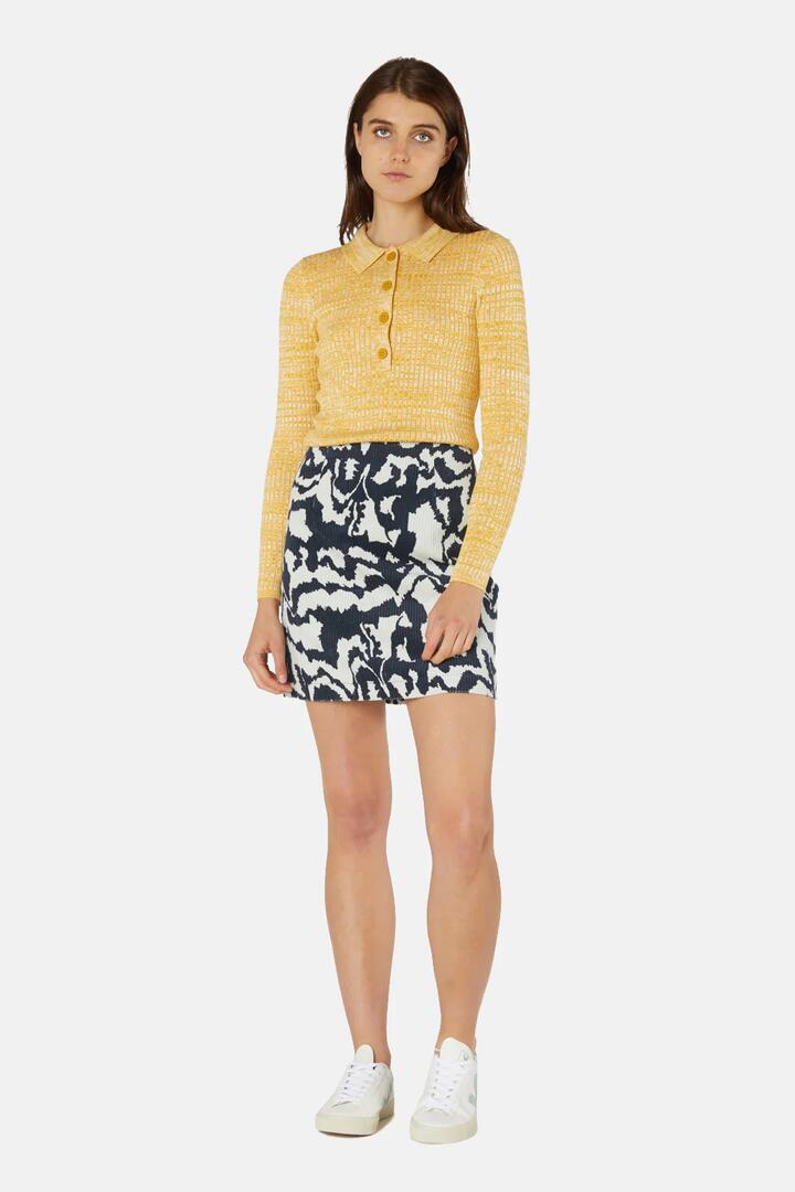 Image of a model wearing Skirts. Product name - Texta MNT Corduroy Mini Dress in Print colour by brand - Gorman