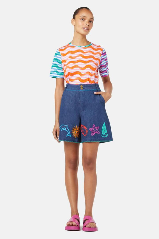 Image of a model wearing Shorts. Product name - Taking Time Embroidered Denim Short in Denim colour by brand - Gorman
