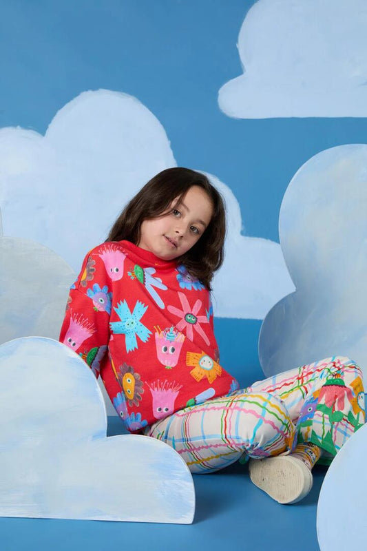 Image of a model wearing Outerwear. Productname: Red Floral Kids Sweater in Red colour by brand - Gorman