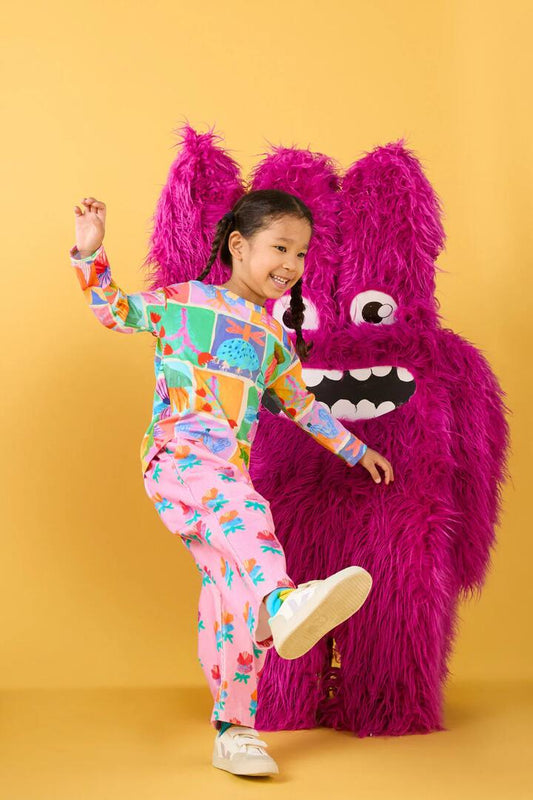 Image of a model wearing Pants. Productname: Lotus Flower Kids Cord Pants in Pink colour by brand - Gorman