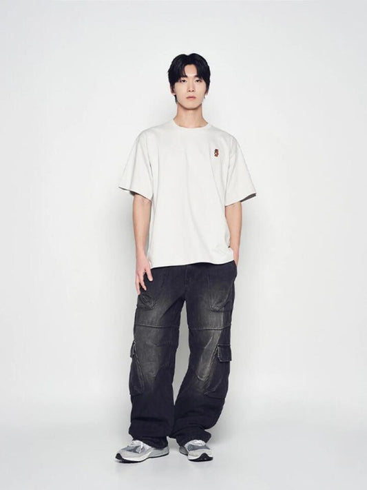 Image of a model wearing Shorts. Productname: ADLV Stand Ac Bear Short Sleeve T-Shirt in Light Grey colour by brand - ADLV