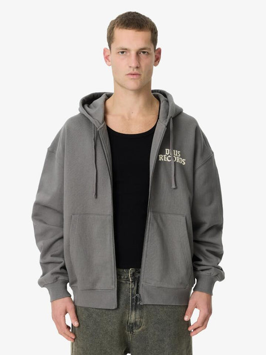 Image of a model wearing Outerwear. Productname: Deus No. 13 Baby Zip Hoodie in Charcoal colour by brand - Deus