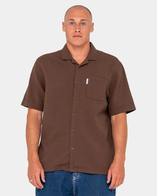 Image of a model wearing Tops. Productname: Rusty - Mens Canseco Vacation Short Sleeve Shirt - Pinecone - in Pinecone colour by brand - Rusty