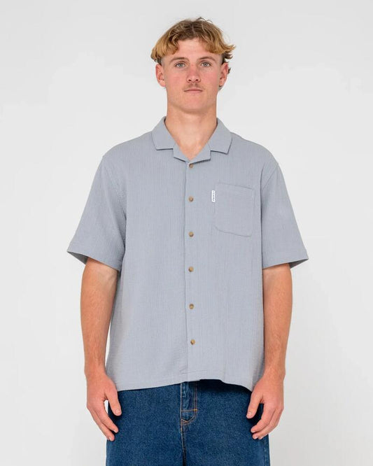Image of a model wearing Tops. Productname: Rusty - Mens Canseco Vacation Short Sleeve Shirt - Ultimate Grey - in Ultimate Grey colour by brand - Rusty