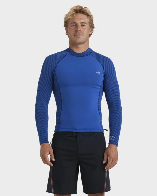 Image of a model wearing Tops. Productname: Billabong - Mens 1/1Mm Revolution Long Sleeve Wetsuit Top - Dark Cobalt - in Dark Cobalt colour by brand - Billabong