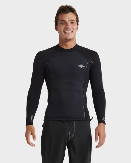 Image of a model wearing Tops. Productname: Billabong Mens 1/1Mm Revolution Pro Long Sleeve Wetsuit Top Black - in Black colour by brand - Billabong