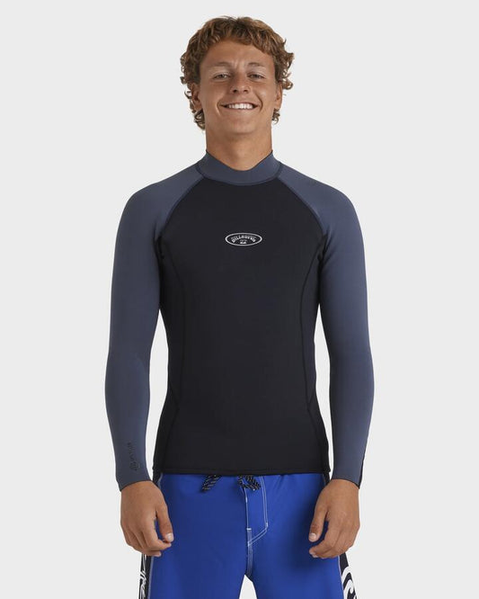 Image of a model wearing Tops. Productname: Billabong - Mens 1/1Mm Absolute Natural Long Sleeve Wetsuit Top - Blue Combo - in Blue Combo colour by brand - Billabong