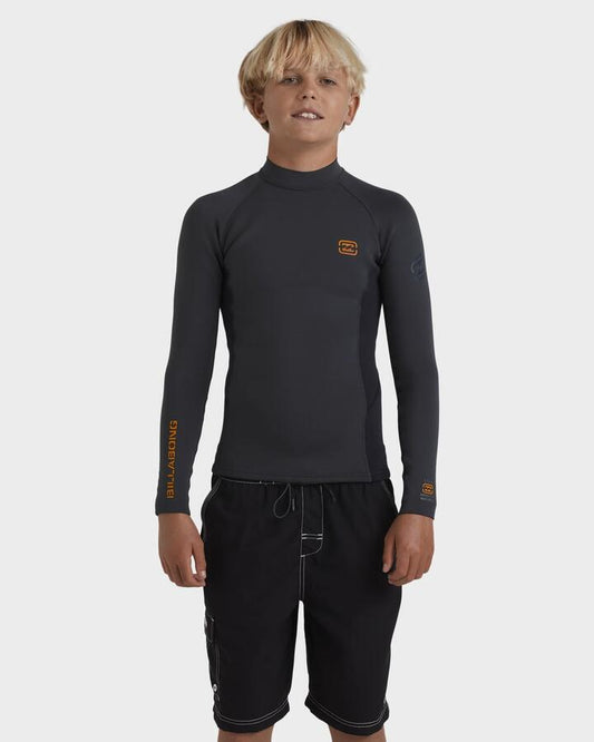 Image of a model wearing Tops. Productname: Billabong Boys 8-16 1/1 Absolute Natural Long Sleeve Wetsuit Graphite - in Graphite colour by brand - Billabong