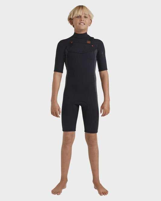 Image of a model wearing Tops. Productname: Billabong Boys 8-16 2/2Mm Absolute Natural Chest Zip Gbs Springsuit Graphite - in Graphite colour by brand - Billabong