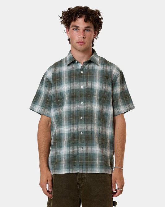 Image of a model wearing Tops. Productname: Thrills - Mens Cheap Thrills Check Short Sleeve Shirt - Brown - in Brown colour by brand - Thrills