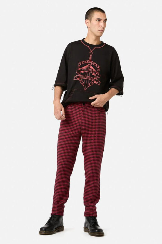 Image of a model wearing Pants. Productname: Virtue Houndstooth Slim Fit Pants in Red/Black colour by brand - Black Friday