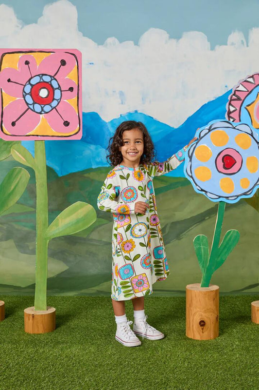 Image of a model wearing Dress. Productname: Wallpaper Kids Jersey Dress in Cream colour by brand - Princess Highway Kids