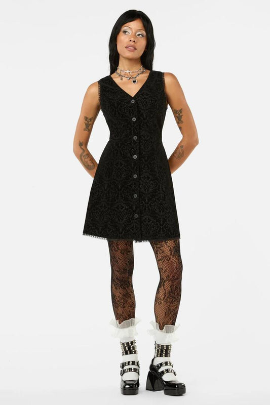 Image of a model wearing Dress. Productname: Not Afraid Velvet Pinafore in Black colour by brand - Black Friday
